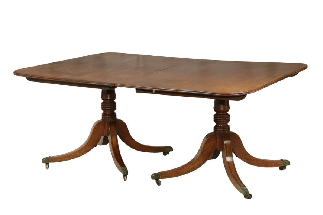TWO-PART DINING TABLE WITH TWO LEAVES: 19th c. Duncan Phyfe Style Mahogany Tilt Top Tables with rounded corners, two wide leaves and batten supports, brass dogs, set on ring turned stanchions with four ebony string inlaid sabre legs ending
