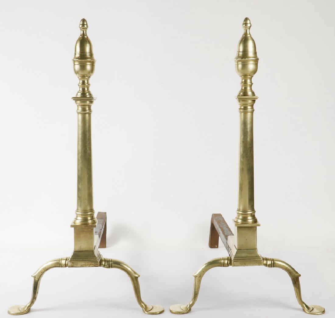 PHILADELPHIA BRASS ANDIRONS: Pair Large 18th c. Philadelphia Brass Andirons, double acorn finial tops, tapering square plinths, spurred legs ending in stepped penny disc form feet, iron dogs, 24" high, 22" x 12 1/2". For similar 