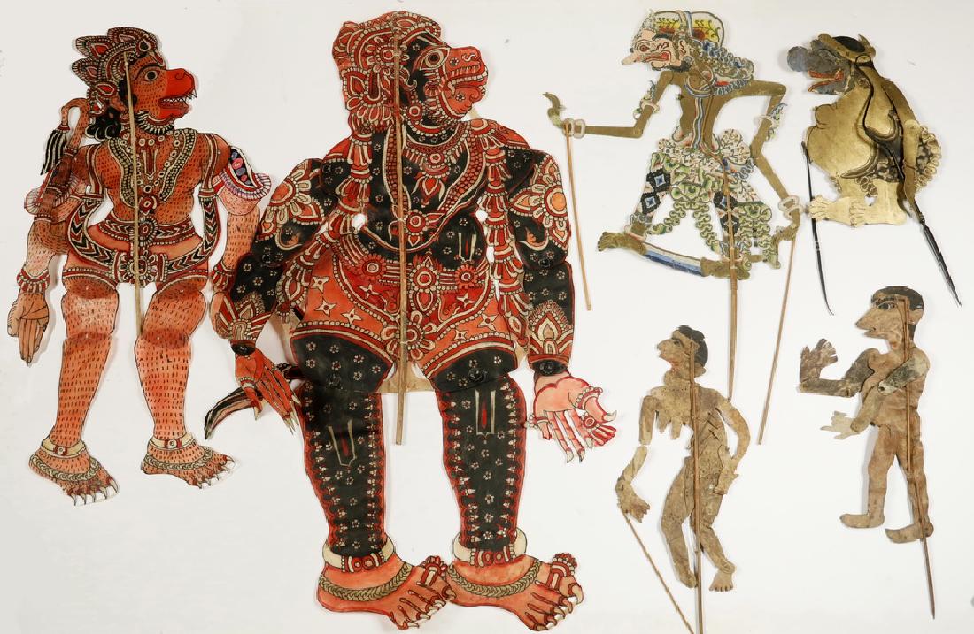 (6) INDONESIAN SHADOW PUPPETS: Indonesia or Java â€˜wayang kulitâ€™ puppets out of cut and painted buffalo skin, with wood or horn sticks, late 19th to early 20th c. The fat figure is 'Semar', the court jester. The two lar