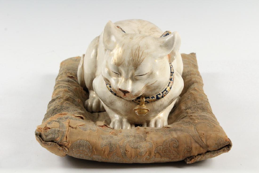 JAPANESE PORCELAIN CAT ON SILK PILLOW (1 of 7)
