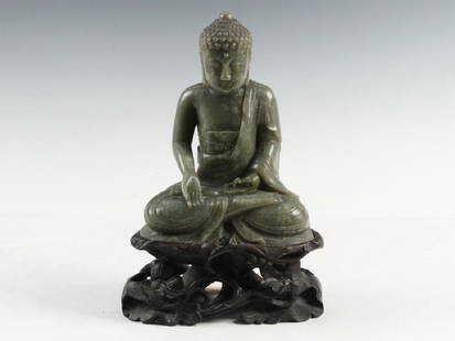 JAPANESE JADEITE BUDDHA: Meiji Moss Green Jadeite Enthroned Buddha in Apan Mudra, mounted with bronze clamps on old reticulated rosewood lotus plinth, 9" tall figure, 12 1/4" tall overall. Fine condition.