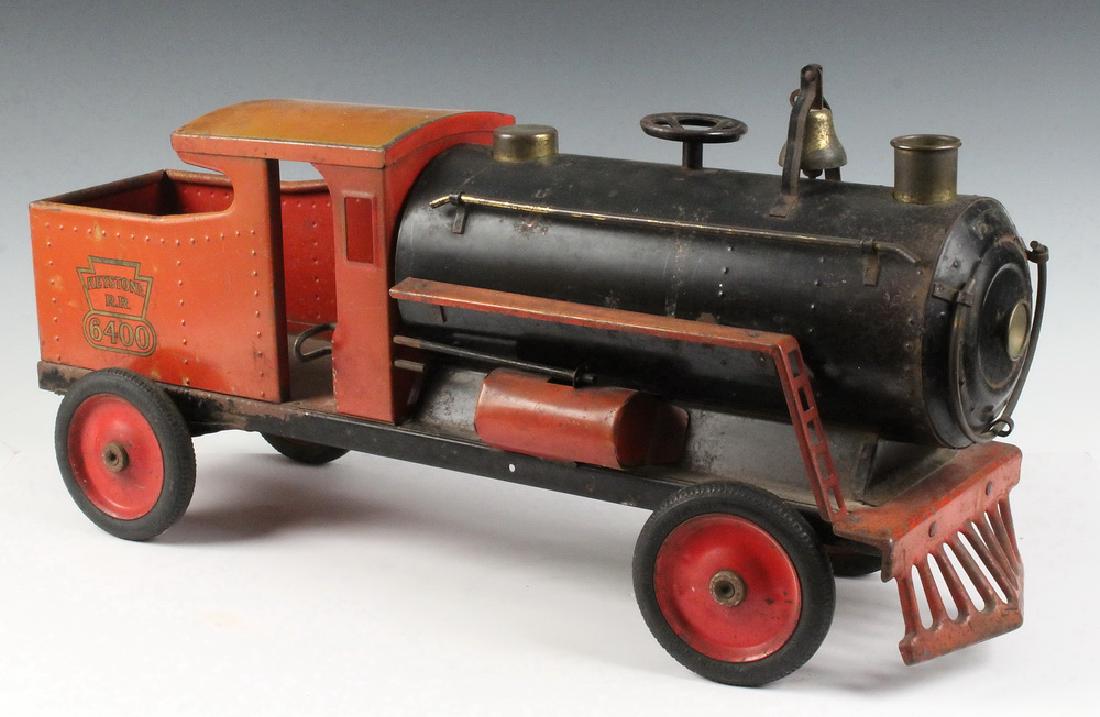 KEYSTONE RAILROAD RIDE ON LOCOMOTIVE TOY: 1930s Keystone RR 6400 Pressed Steel Ride On Locomotive Toy, with simulated headlight brass rail, smokestack, bell and cowcatcher, interior decal, small handle steering wheel, four original balloon ti