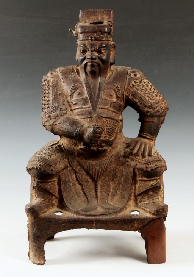ANCIENT CHINESE CAST IRON TEMPLE FIGURE: 14th-15th c. Ming Dynasty Figure of enthroned Guandi, with evident casting seams and vent holes, roughly 27" x 15" x 10". Nice surface, wooden replacement to one leg of throne.