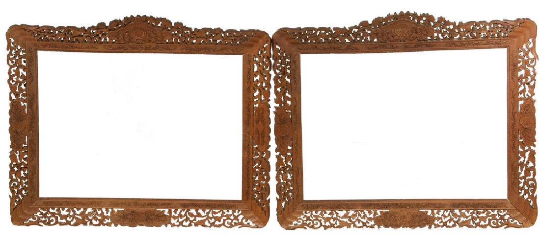 PAIR CARVED CHINA TRADE FRAMES: Pair of 19th c. China Trade Hand Carved Wooden Picture Frames in sandalwood, intricately carved with openwork and floral and foliate decoration, horizontal orientation, cut out area: 18 1/4" x 24", OS