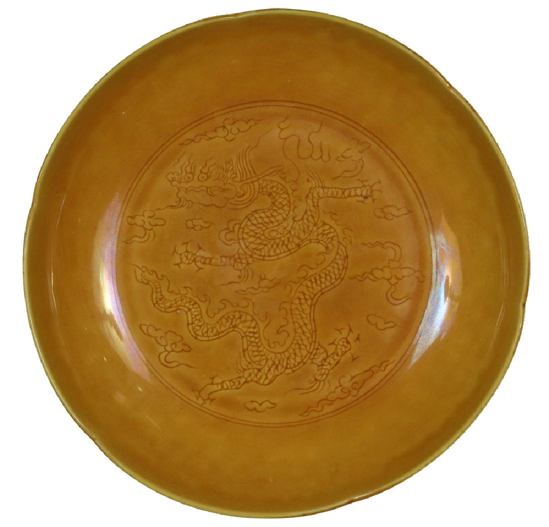 CHINESE YELLOW GLAZED LOW BOWL: Chinese Porcelain Low Bowl, scalloped edge with yellow glaze and incised dragon decoration, Hongzhi six character mark on base, 1 3/4" high, 8 5/8" diam. Recent repair.