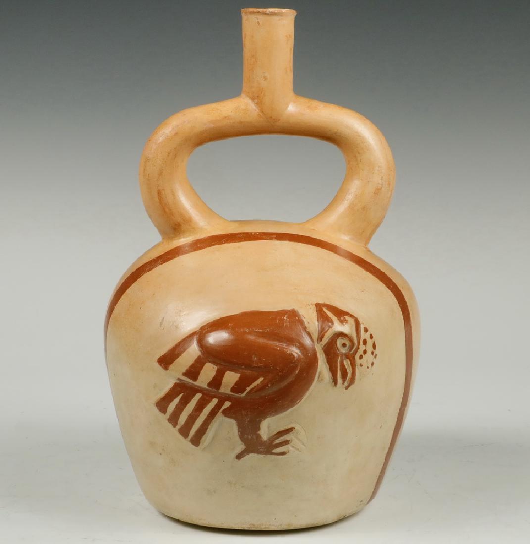 PRE-COLUMBIAN POTTERY: Moche, North Coast Peru. 200 AD. Stirrup Vessel having Condor in high relief. 10" high, 6" diam. Top rim glaze frits. Provenance: H.J. Westermann Coll. Germany.