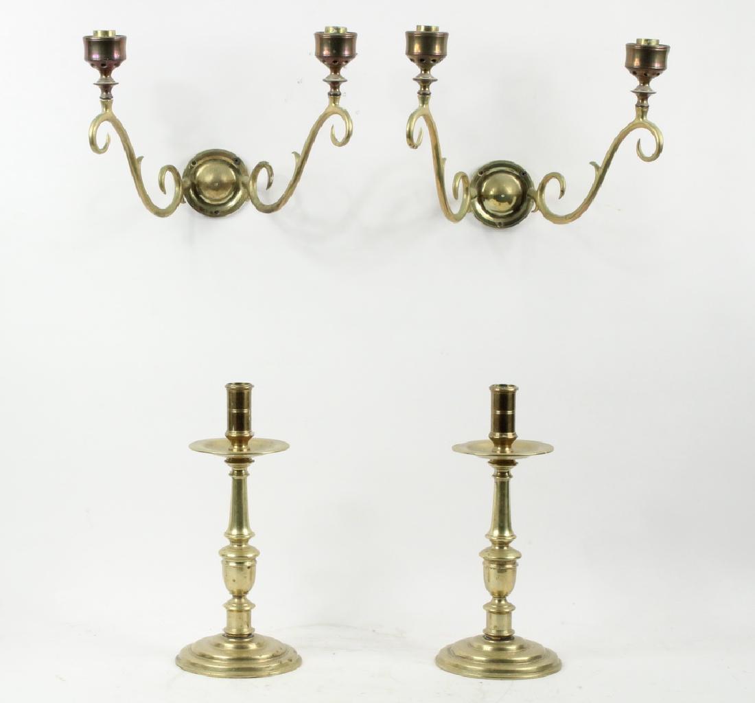 PR CANDLESTICKS & PR DOUBLE WALL SCONCES: Pair of Virginia Metalcrafters Brass Candlesticks, with brass mounted clear glass hurricane shades, 17th c. style, with mid-stem drip pans, 12 3/4" high, 5 3/4"diam.; and Pair of brass double-arm cand
