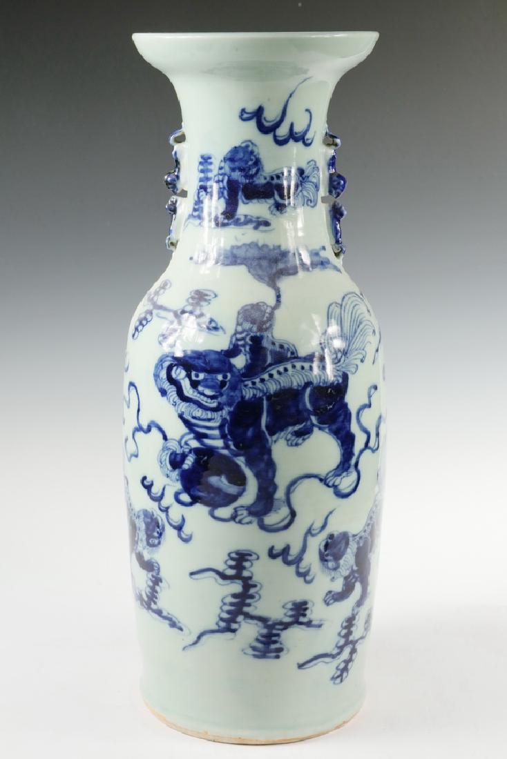 CHINESE FLOOR VASE: Chinese Blue & White Porcelain Vase, 20th c., with decoration depicting foo dogs amongst the clouds, with double foo dog side handles, 22 1/2" high, 8" diam. Good condition.