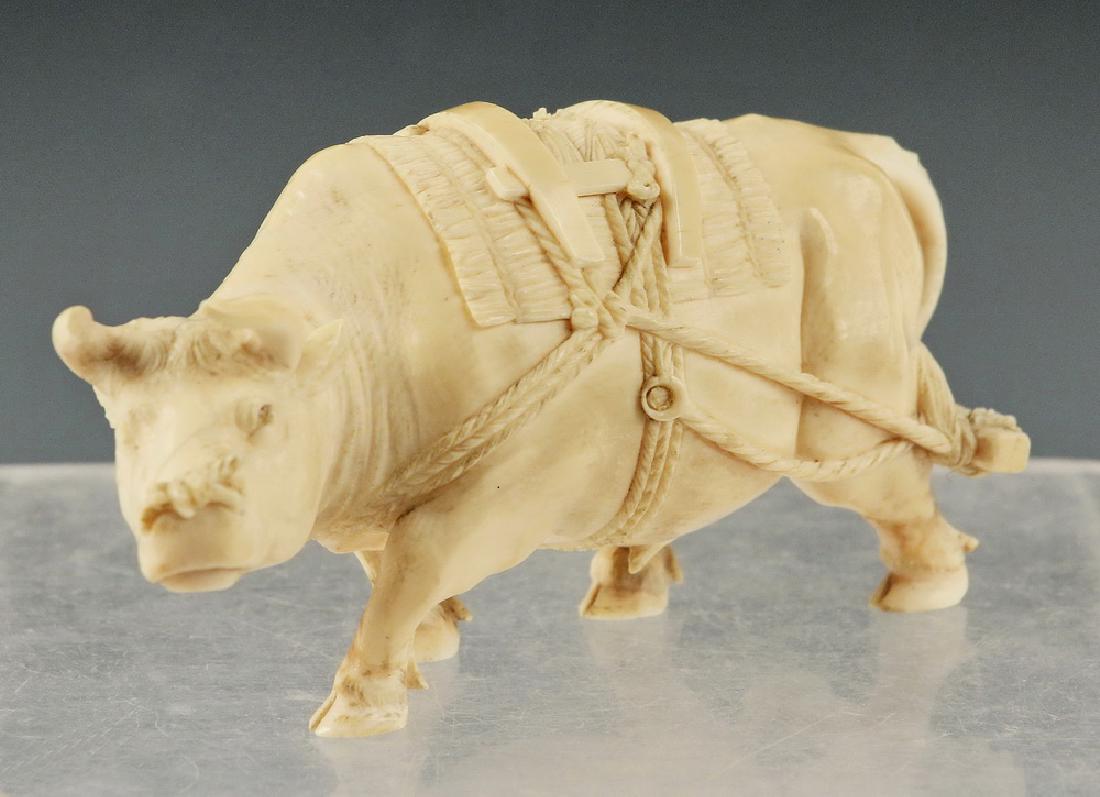 19TH C. JAPANESE OKIMONO: Meiji Period Figure of a Water Buffalo in harness to plow, unsigned, 5 1/4" long. Missing tip of one horn, fine hairline on underside, otherwise good.