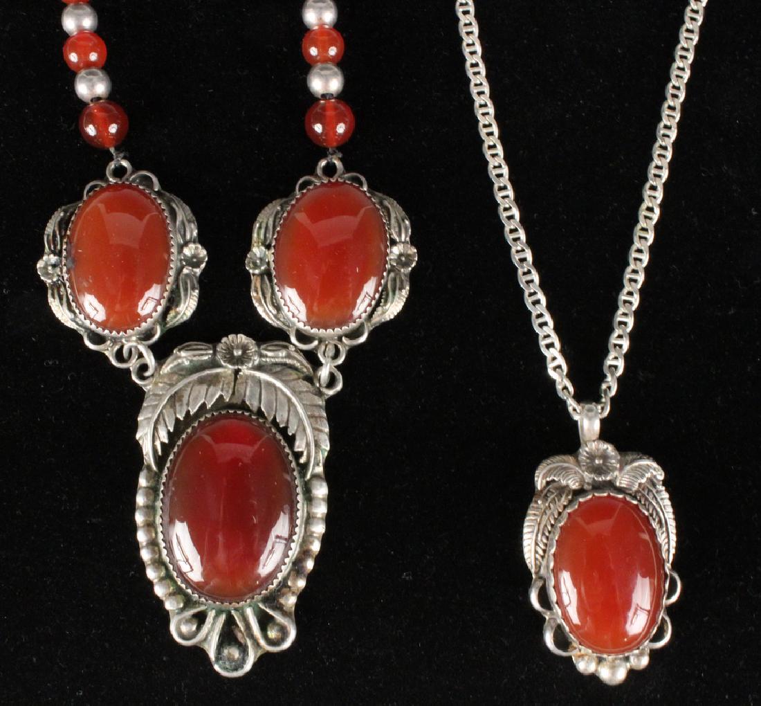 (2) STERLING & CARNELIAN NECKLACES: (2) Southwestern Design Sterling and Carnelian Necklaces, handcrafted by Dave Tobler, including: Graduated carnelian and hollow silver bead necklace centered by a triple sterling pendant set with thre