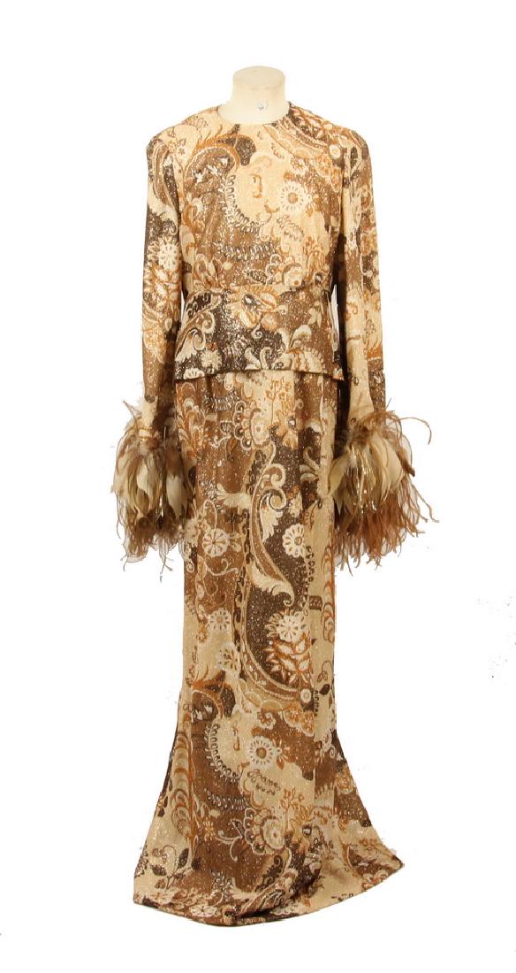 BILL BLASS EVENING GOWN: 1970s Era Designer Gold Lurex Knit Dress by Bill Blass, with feather cuffs and belted waist, in shades of taupe, copper and tan, cream silk lining, with Bill Blass label, originally retailed by I. Mag