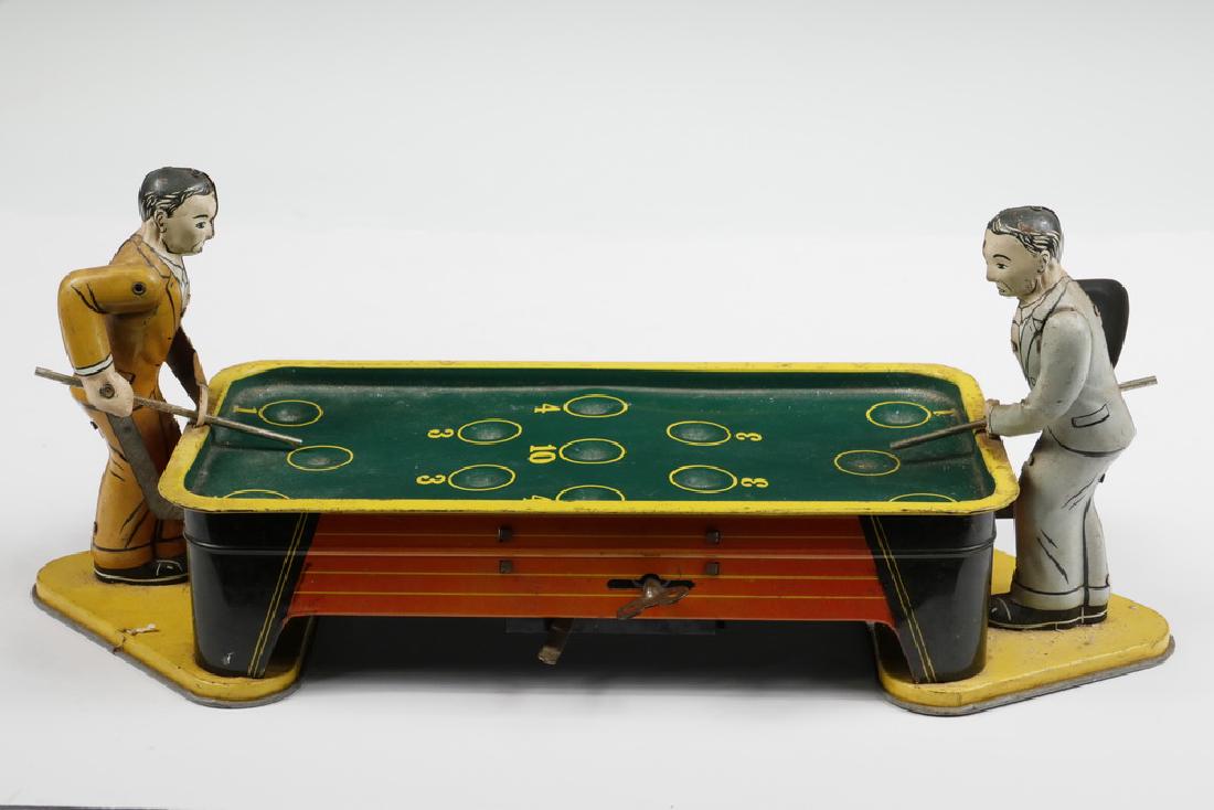 RANGER STEEL TIN LITHO BILLIARDS GAME: 1940s Ranger Steel Tin Litho Wind-Up Pool Players Game, with two player figures, 5 3/4" high, 14" x 5". Surface wear, missing marbles, wind-up mechanism is overwound and sticks, no box.