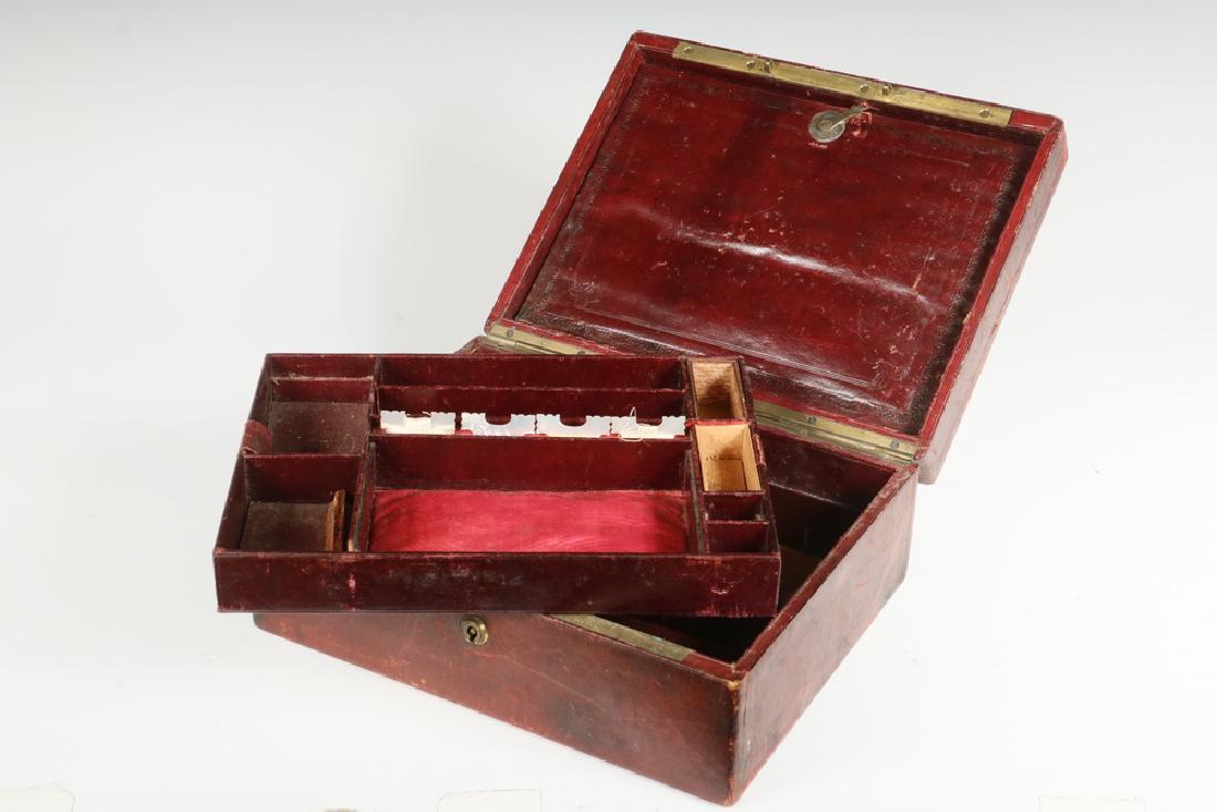 TIFFANY, YOUNG & ELLIS SEWING BOX: Mid-19th c. Leather Covered Sewing Box, retailed by Tiffany, Young & Ellis, New York, fixed price luxury goods store in business from 1841-1853, with brass flat mounted top handle and lock escutcheon 