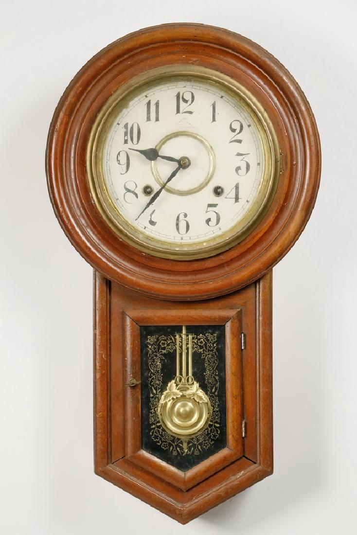 EARLY JAPANESE MADE SCHOOL REGULATOR CLOCK: Keywind 8-Day Time and Strike Meiji Clock Co. Wall Regulator Clock in a mahogany case, circa 1895-1910, includes original pendulum and replacement key, marked on the cast iron chime mount. 22 1/2" x 1
