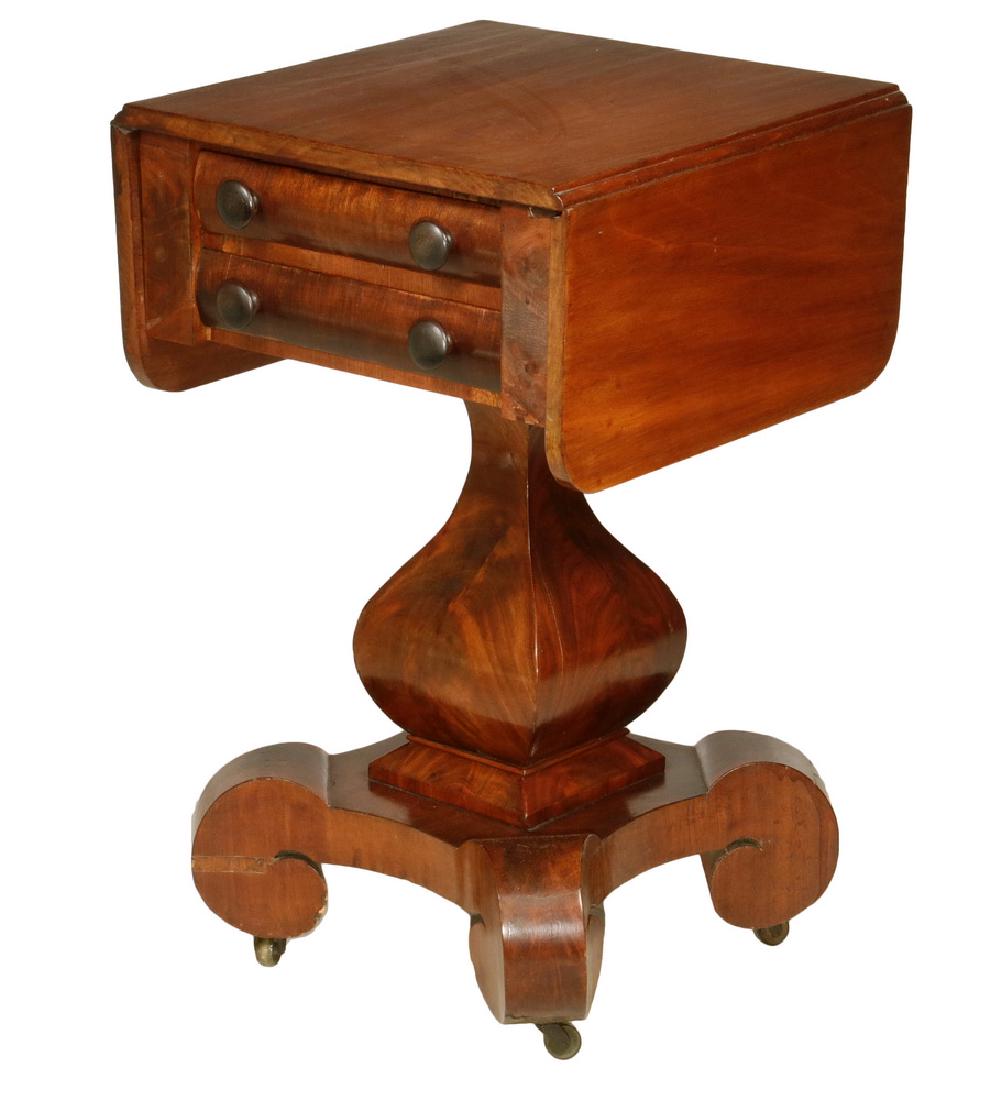 TWO DRAWER DROP LEAF EMPIRE STAND: American Work Stand, circa 1830, in dark mahogany, with rounded corner drop leaves, uppermost drawer partitioned, pine secondary, having convex drawer fronts with mushroom knobs, squared vase form ped