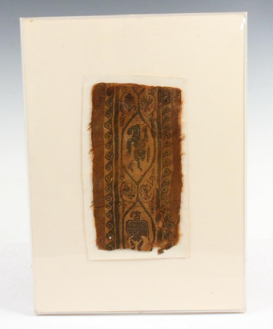 COPTIC TEXTILE FRAGMENT: Sleeve band with Bacchic dancers, a swimmer, and two dogs, having a wave border, (Egypt, 4th-7th c. CE), natural linen and Tyrian purple wool, housed in a lucite box frame, OS: 12" x 16 1/2", textile 