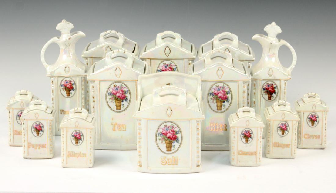 (14 PC) MEPOCO WARE CANISTER SET: (14) Piece Vintage German Mepoco Ware Ceramic Canister Set, early 20th c., with iridescent glaze and floral decoration, including: (5) Canisters, 7 1/4" high, hairline cracks to coffee jar, one hairli
