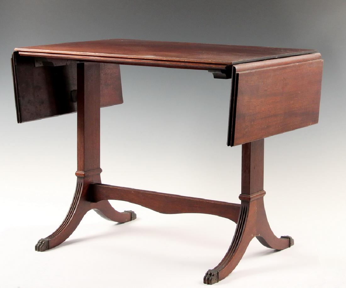 SMALL DROP LEAF COFFEE TABLE: 1930s Vintage Duncan Phyfe Style Coffee Table in mahogany with brass capped feet on the trestle ends, 18" x 15 1/2" x 23", with 6" leaves. Good condition, dry finish.