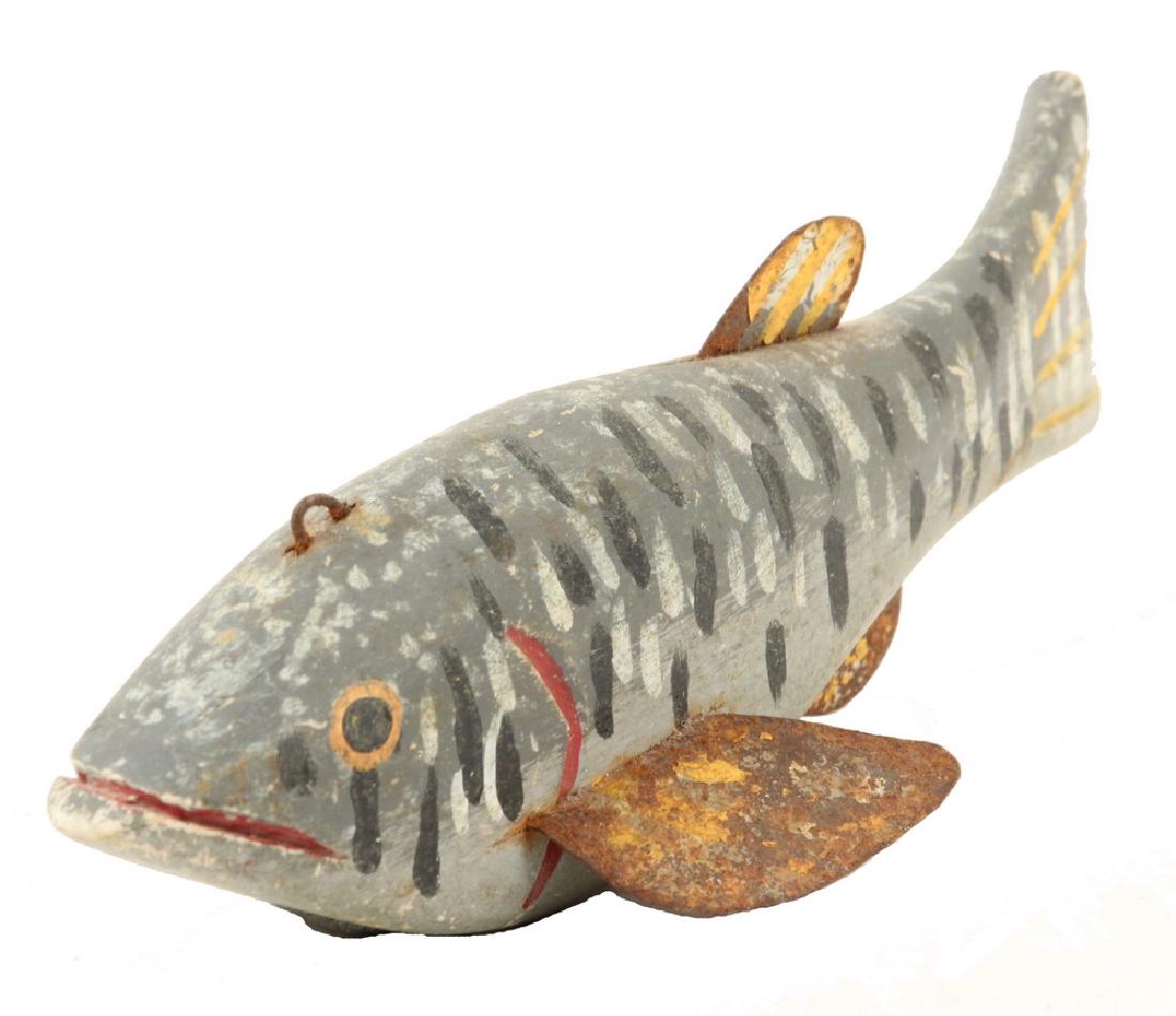 FISH DECOY ATTRIBUTED TO OSCAR PETERSON: Oscar W. "Pelee" Peterson (MI, 1887â€“1951), large freshwater decoy, in carved and brightly painted wood with tin fins and inletted lead weight, 8". Some wear and paint loss from use.