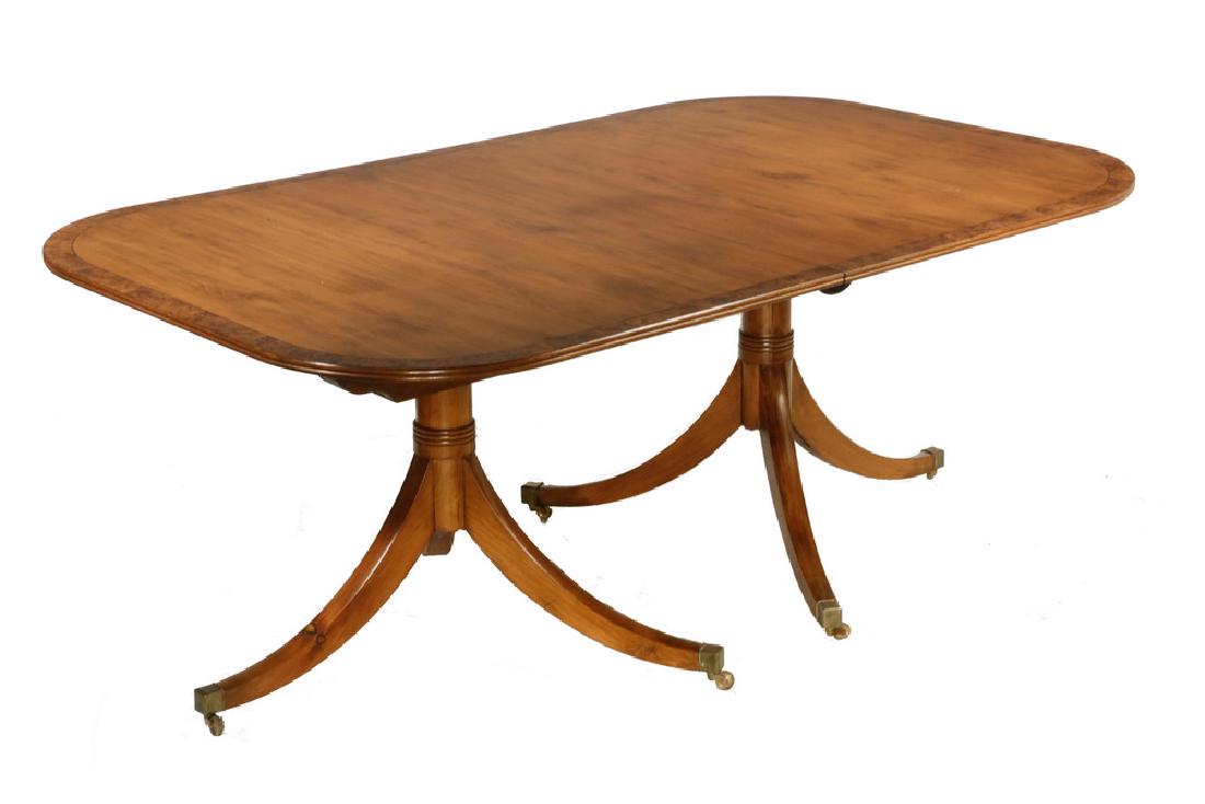 TWO-PART DUNCAN PHYFE STYLE DINING TABLE: Custom ca. 1900 Dining Table with two leaves, the table having rounded corners, reeded edge, sturdy ring turned tapered stanchions resting on tapered square swan leg tripods ending in brass capped cas