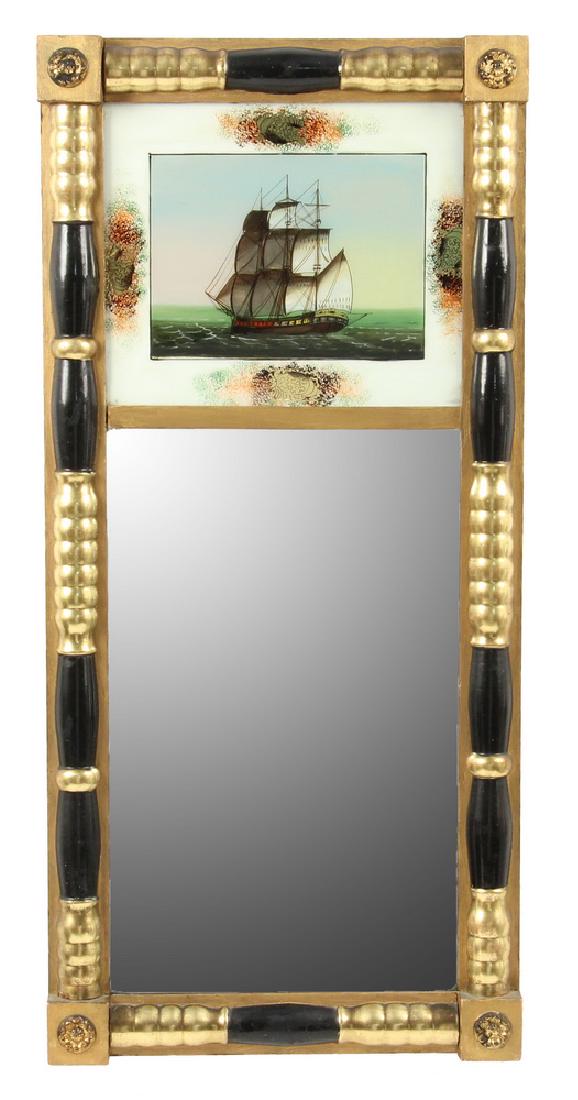 FEDERAL PERIOD EGLOMISE MIRROR WITH MARITIME THEME: Circa 1810 Looking Glass with split column and rosette corner blocks in black lacquer and gilding, retaining the original eglomise panel depicting the stern view of a brigantine sailing ship, 29 3/4" 