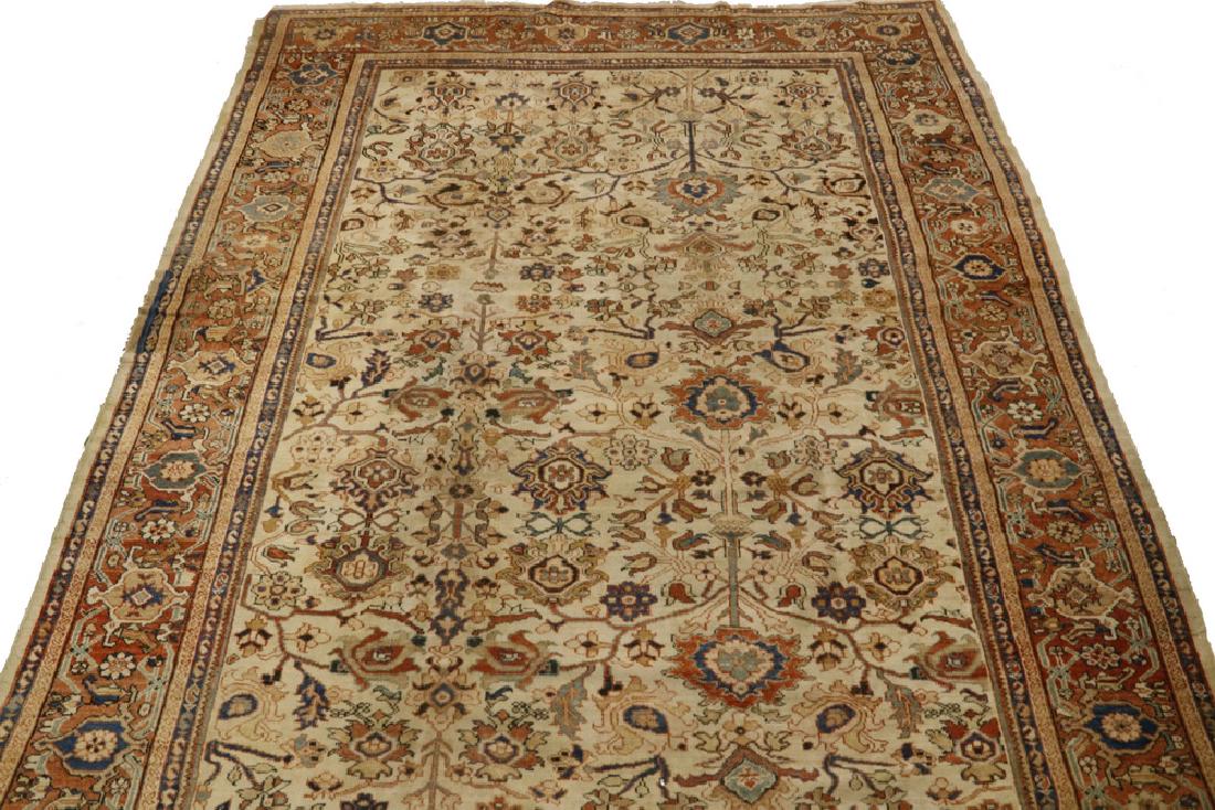 MAHAL CARPET - 8'-10" X 14': West Persia, early 20th c., overall design of palmettes, rosettes and curved blossoming vines in navy and sky blue, gold, blue-green and terra cotta on the light tan field, terra cotta 'turtle' border