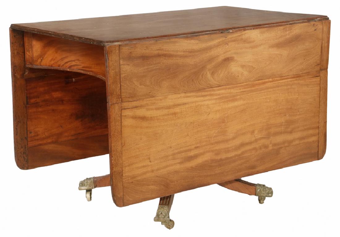 DROP LEAF TABLE: English Chippendale Drop Leaf Pedestal Table, early 19th century in walnut and walnut veneer with pine secondary, having long leaves with breadboard ends and rounded corners, the beaded edge top resti