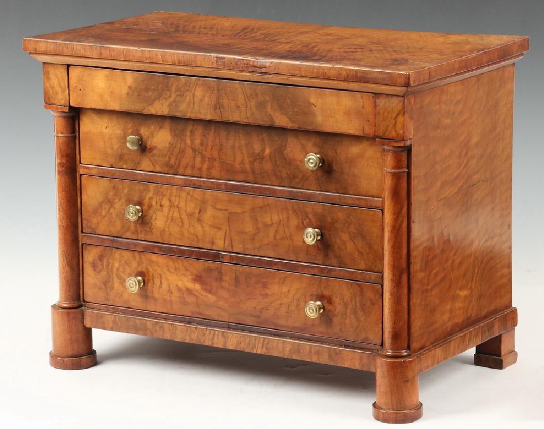 MINIATURE BIEDERMEIER CHEST: 18th c. Miniature Flame and Figured Grain Miniature Four-Drawer Chest, probably a salesman sample, with rectangular segmented veneer overhanging top above a shallow drawer with three recessed drawers 
