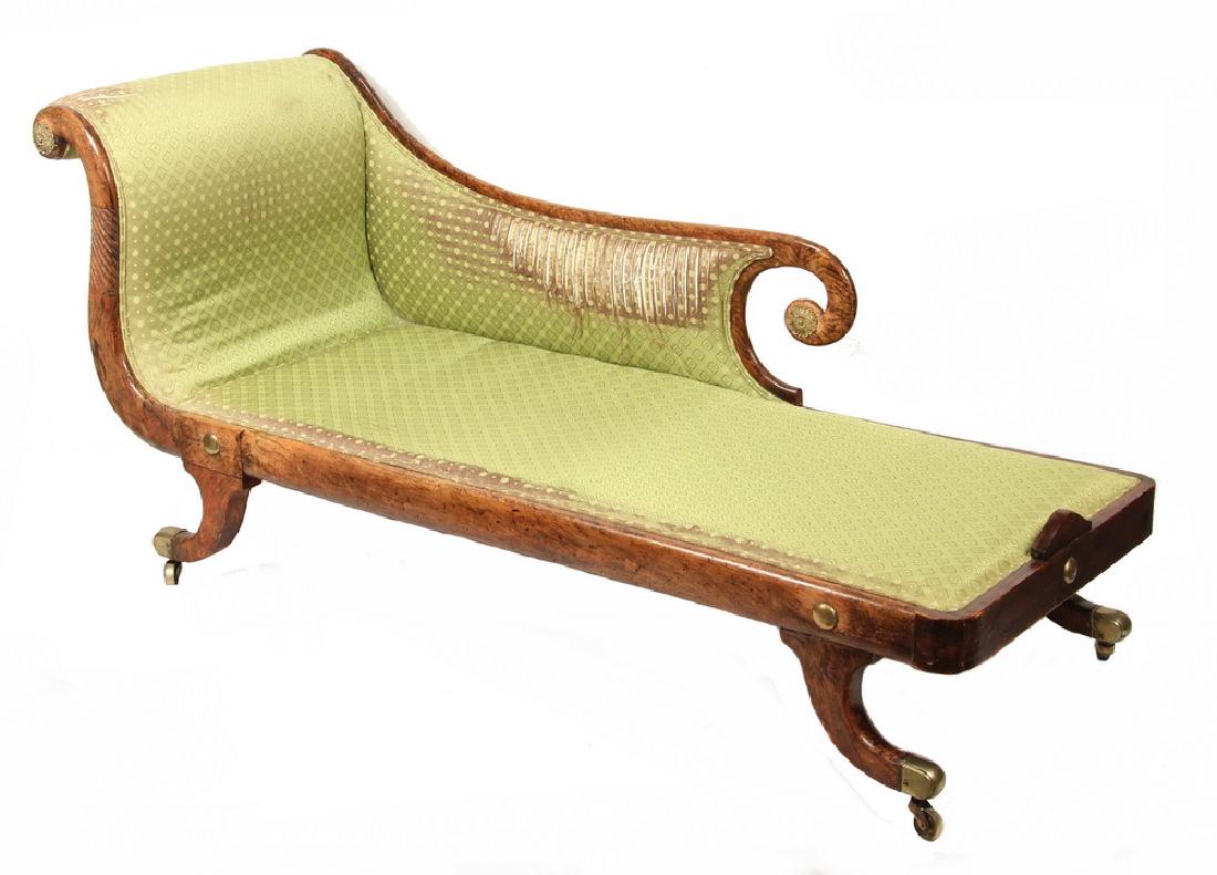 REGENCY PERIOD DAYBED: English Rosewood Recamier in Classical Form, with scrolled end half length back, reclined rest at one end, the frame with brass accents, sabre legs having brass caps with large casters, in remnants of