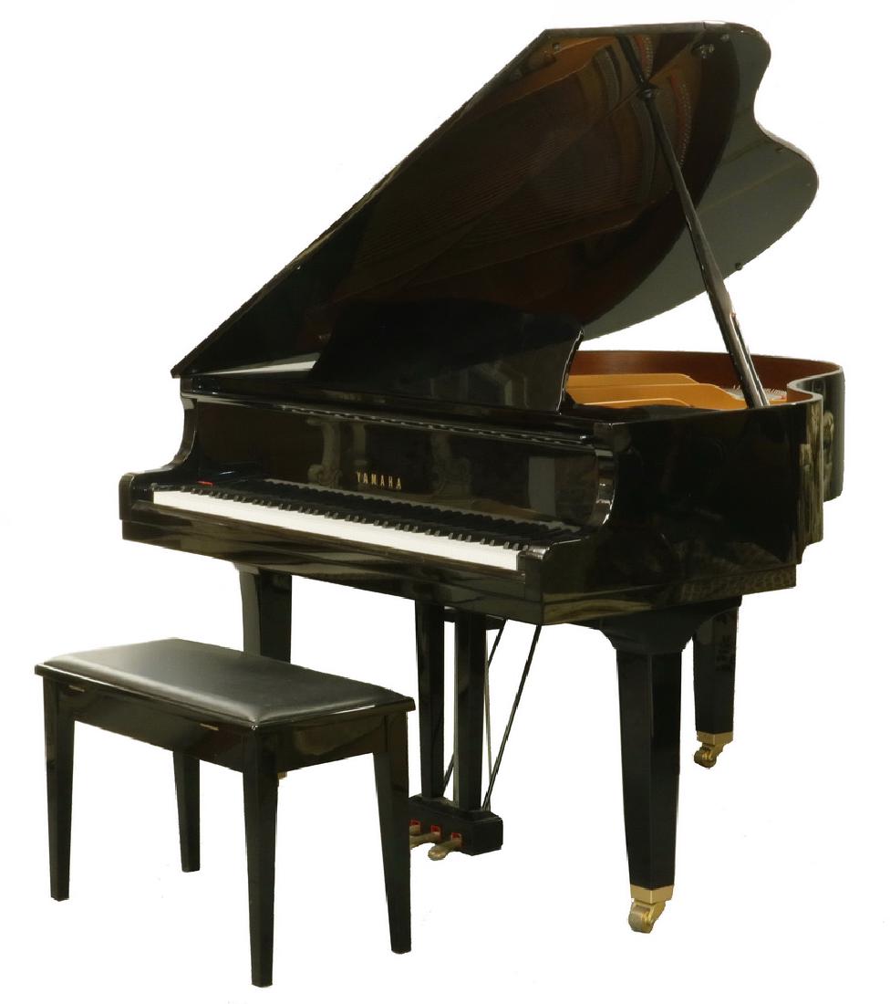 YAMAHA GA1 BABY GRAND PIANO: Acoustic Piano in high gloss black, E grade, with bench. Serial No. J2007993, circa 1999. 60" x 57 1/2" x 39 1/2", the bench is 19" x 30" x 14". Good playing condition, a few small edge dents to the l