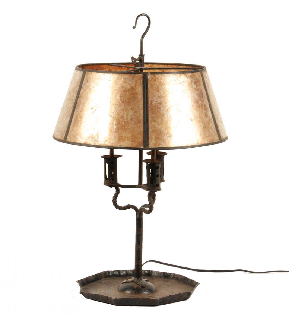 WROUGHT IRON TABLE LAMP: Vintage Arts & Crafts Bouillotte Style Three Socket Iron Table Lamp, with mica covered shade, triple arm candle form stem set in a pan form base, turn switch at base of stem, hook form finial, 24" hig