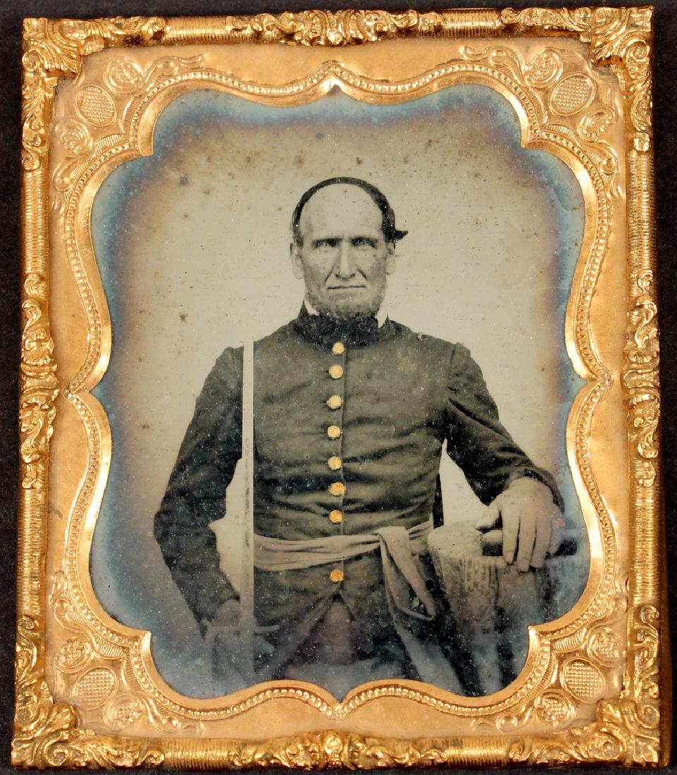 CASED AMBROTYPE PHOTOGRAPH OF A CIVIL WAR US ARMY: Sixth-Plate Ambrotype of an Elderly Balding US Army Officer, found in Rockland, Maine, (home of the 4th Maine Infantry Regt), with waist sash and shoulder boards, gold painted buttons, his bared sword