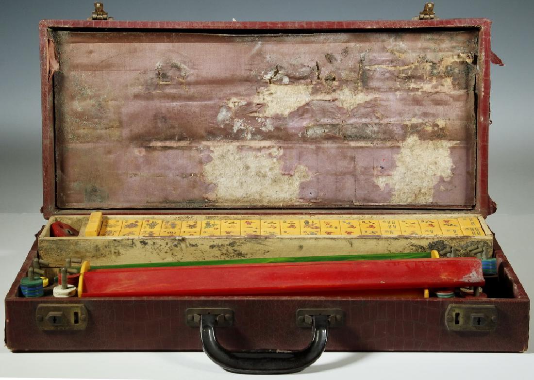 CASED MAHJONG SET WITH BAKELITE TILES: Vintage Mahjong Set, including (162) bakelite tiles, (5) bakelite player tile racks, and (1) rotating counter, in a crocodile embossed fabric covered case with two lockable clasps (no key), 3 1/4" hig