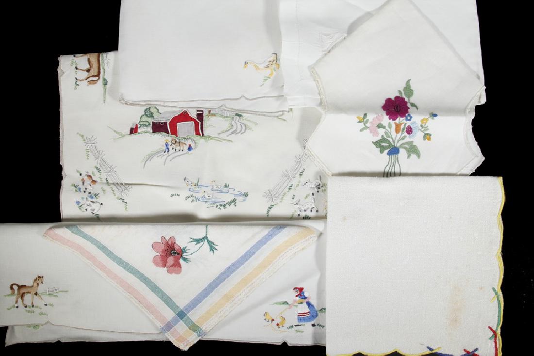 1930S CLOSET STORAGE BOX OF LINENS: Japanese Cloth Covered Box containing 1930s linens with bright embroidery work, including Set of (8) Placemats & Napkins with American farm (buildings, people & animals); Napkins with embroidered flow
