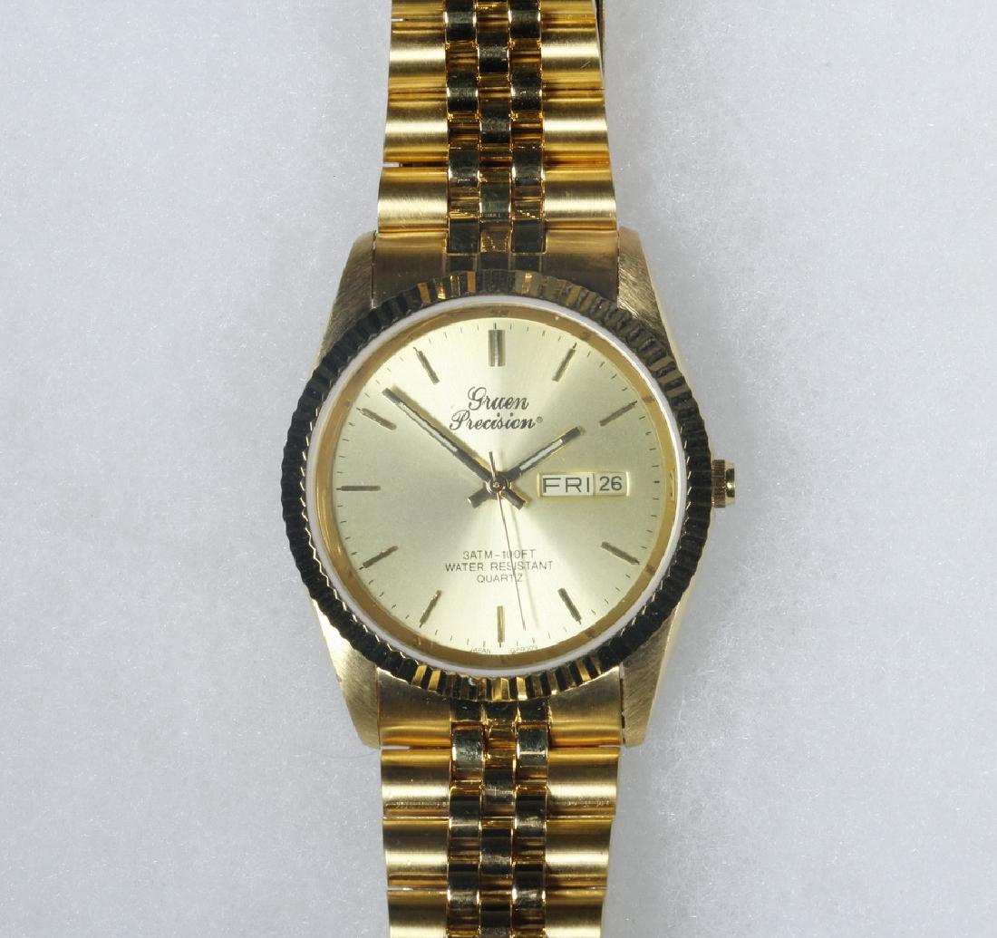 GENT'S WRISTWATCH: Gruen Precision Quartz Wristwatch, stainless steel with day/date, in original box with papers.