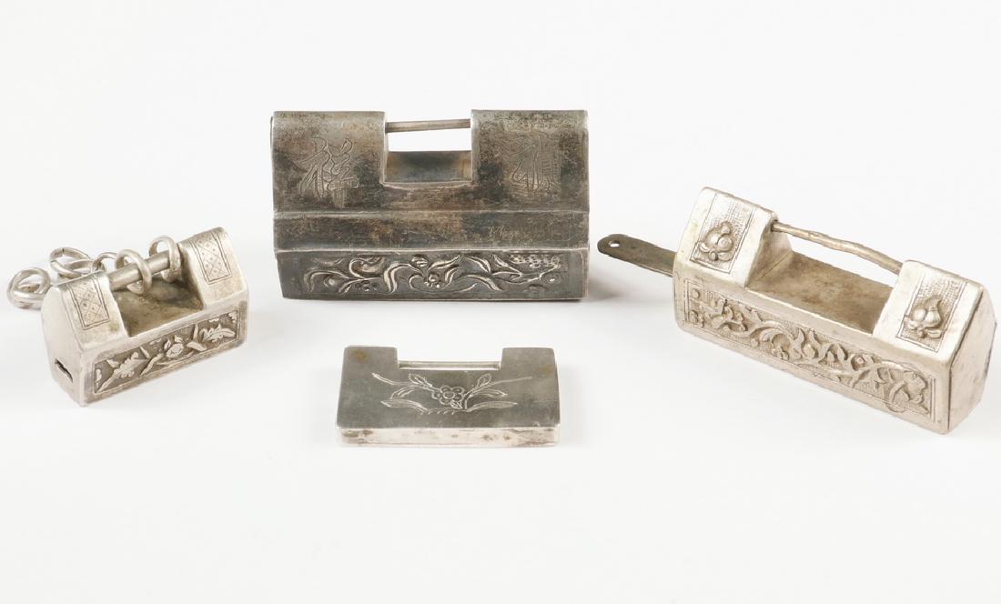 (4) CHINESE SILVER LOCKS: Group of (4) Late 19th - Early 20th c. Chinese Silver Locks, with carved, repousse and engraved floral and character decoration, all unmarked, sizes range from 1" x 1 1/2" x 5/8" to 1 1/2" x 2 1/2" x 