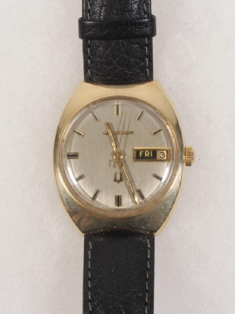 GENT'S WRISTWATCH: Vintage Bulova Accutron Wristwatch with 14K yellow gold round head and day date, serial #G92306 M9. Recently serviced, with new black leather band.