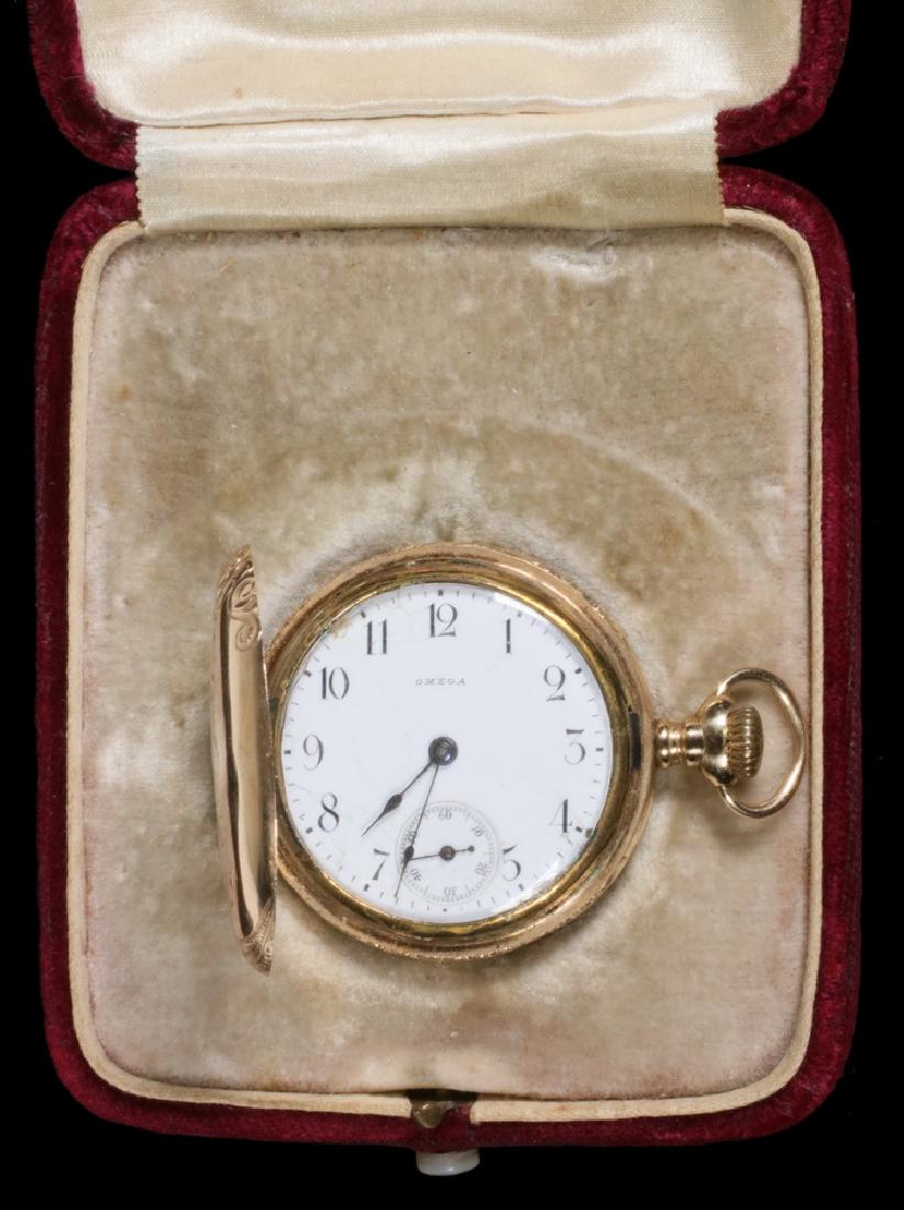 LADY'S POCKET WATCH: Hunter Case Pocket Watch in 14K yellow gold, beautifully engraved with birds and flowers, by Omega, 15 jewel movement, #1403855, engraved "Mamie 1899", 1 1/4" diam., in original box. Appears to be run