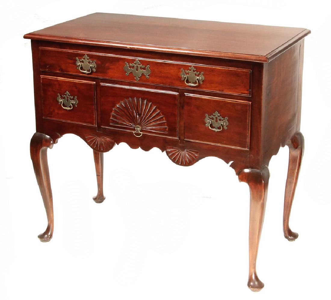 NEW ENGLAND QUEEN ANNE SERVER: Diminutive Maple Server in cherry finish, the rectangular molded edge overhanging top on a case containing a single width shallow drawer over three deep drawers, the center shell carved, with large wi