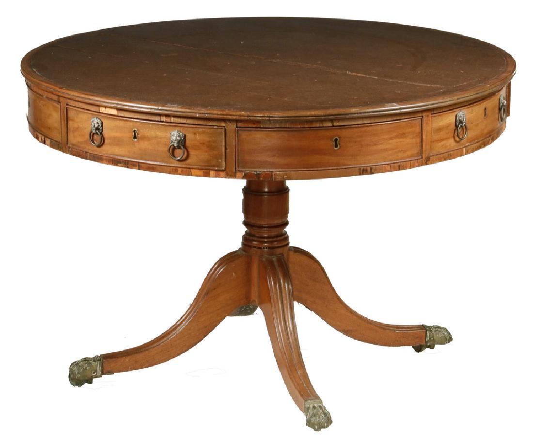 LEATHER TOP DRUM TABLE: Federal Period Library Center Table with brown leather fixed position top, six drawers of various configuration (triangular, short and long depth), all with beaded edge and brass lion head ring pulls,