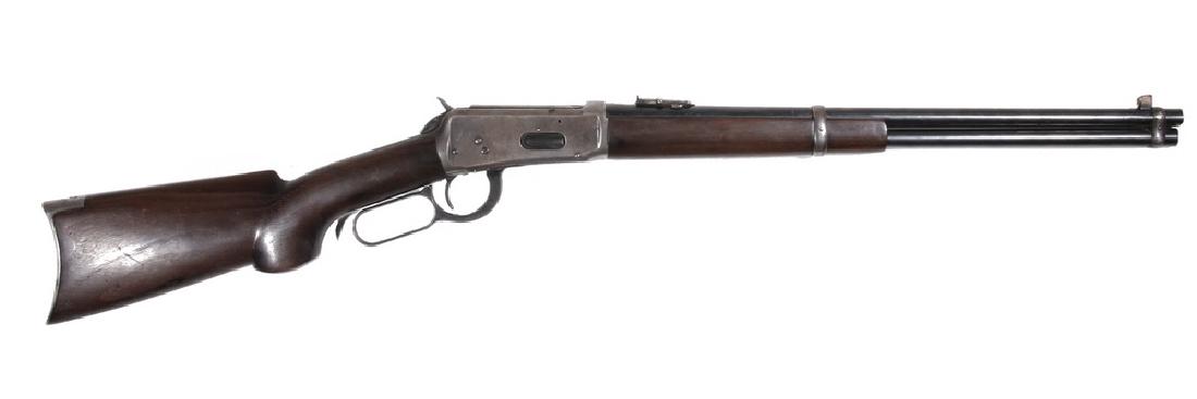 MODEL 1894 WINCHESTER RIFLE: .30 W.C.F. Winchester Lever Action Rifle, Model 1894, s/n 866802, (1917), with custom carved butt, leather wrapped saddle ring, adjustable rear sight, copper blade front sight, nickel-steel blued barr