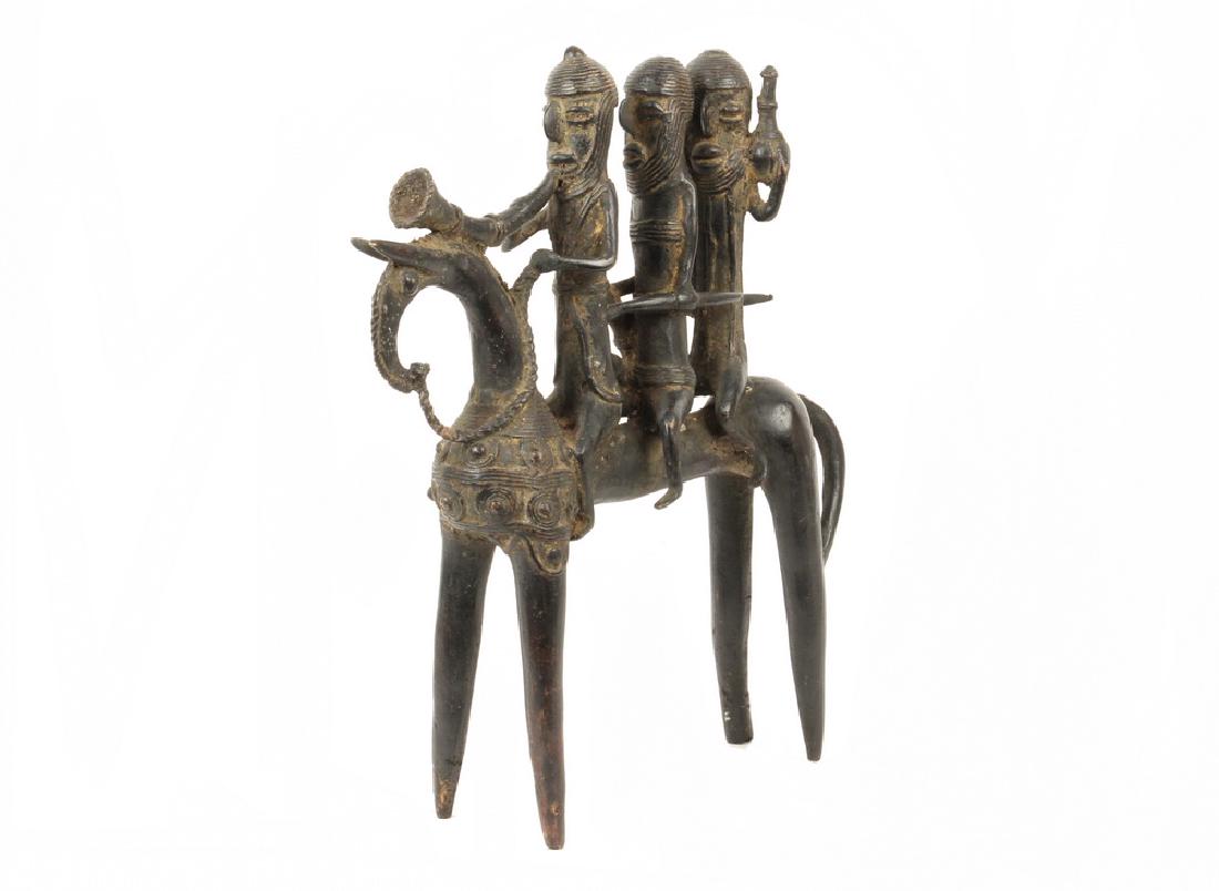 19TH C. FINE SAO KOTOKO STYLE EXTRA LARGE CAST BRONZE: Primitive Art African Bronze Putchu Guinadji Rider Figurine - Sao / Kotoko - Cameroon / Chad. Lost wax method, from Benin kilns. Depicting three warriors, two with weapons and shields, the third playi