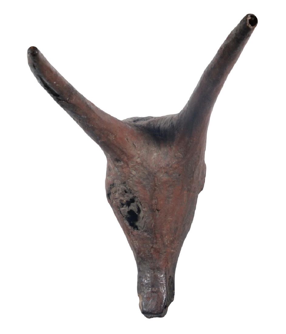 IGBO ANTELOPE MASK: 19th c. Carved Antelope Mask, Igbo People, Nigeria, with red painted surface and remnants of old paint decoration, 19 3/4", 13" x 10 1/4". Chips, surface wear, paint losses.