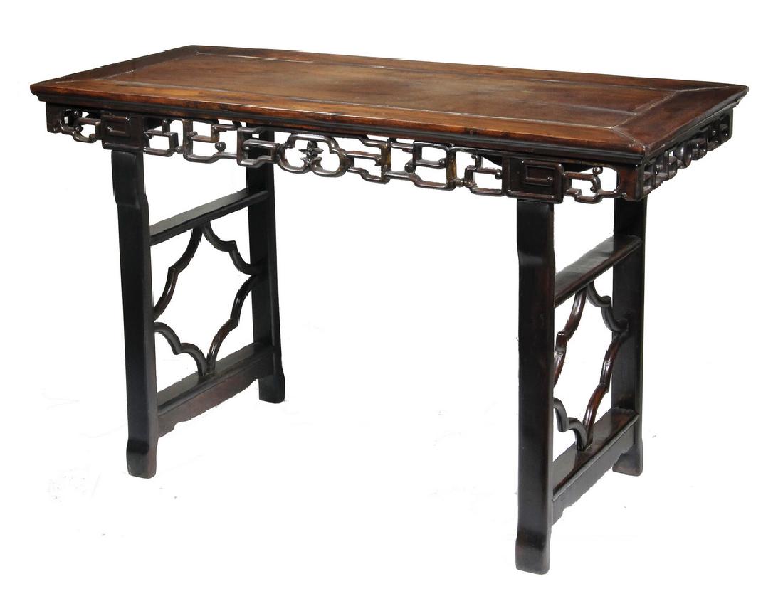 ALTAR TABLE: 19th c. Chinese Altar Table in rosewood, having a panel top, reticulated lingxi skirt, trestle legs with openwork, 32" x 51" x 22". Old repairs, separation to top.