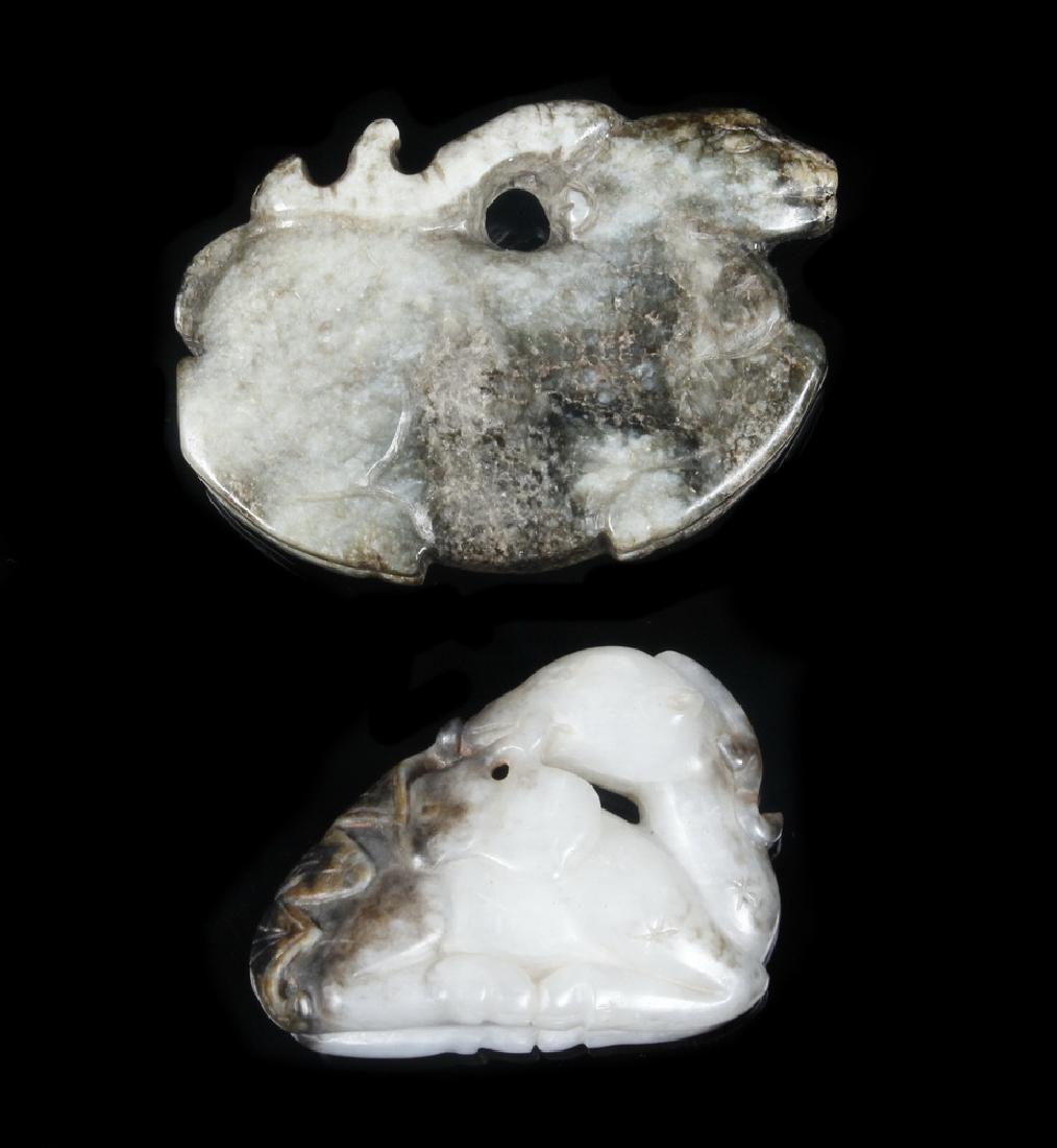 (2 PC) 18TH C. CHINESE CARVED MOSSY JADE DEER AMULETS: Archaic style Reindeer amulet, 2" long; PLUS Recumbent Deer with Bat and Plums, 1 1/2" long. Nicely worn. Provenance: From the estate of Nancy Hamilton.