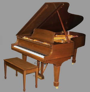 STEINWAY STUDIO GRAND PIANO: Seven Foot Grade B Piano, s/n 522721, (manufactured in 1991), in a walnut Hepplewhite case with tapered square legs ending in spade feet, includes matching bench. Instrument interior and works well pr