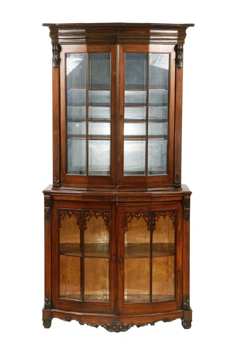 TWO-PART CURIO CABINET: Victorian Rosewood and Walnut Glass Front Vitrine with maple interiors, having faceted fronts with delicate mullions, conforming molded flat cornice, the upper cabinet slightly stepped back, four shel