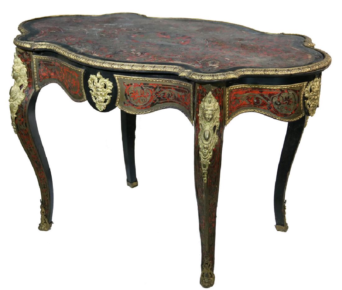 BOULLE SINGLE DRAWER CENTER TABLE: Quality 19th century French Boulle inlaid serpentine shaped center table, with Roman chariot fountain depicted at center, overall scroll, leaf and urn decoration, ormolu molded edge, Green Man mounts 