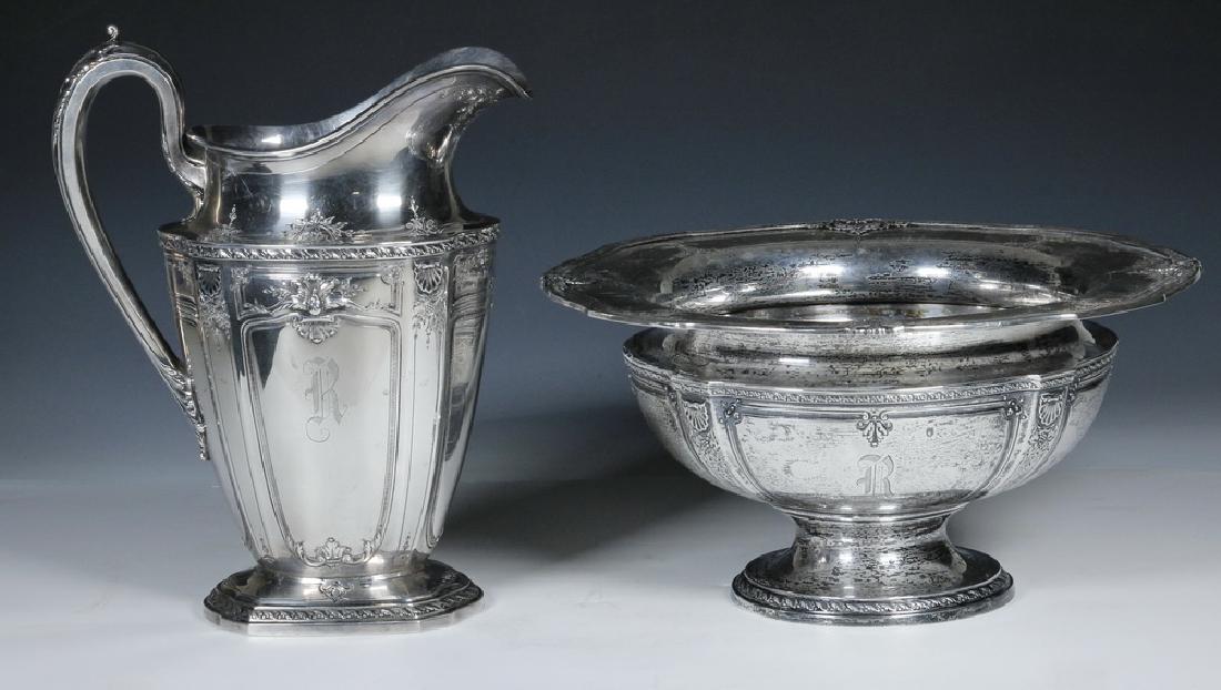 (2) REED & BARTON HERITAGE PATTERN SERVING PCS: (2) Reed & Barton Sterling Silver Heritage Pattern Table Accessories, #940C, both with R monogram, including: Water pitcher, 10" high, 8" wide; and Center bowl with flared rim, 5 5/8" high, 11" diam.;