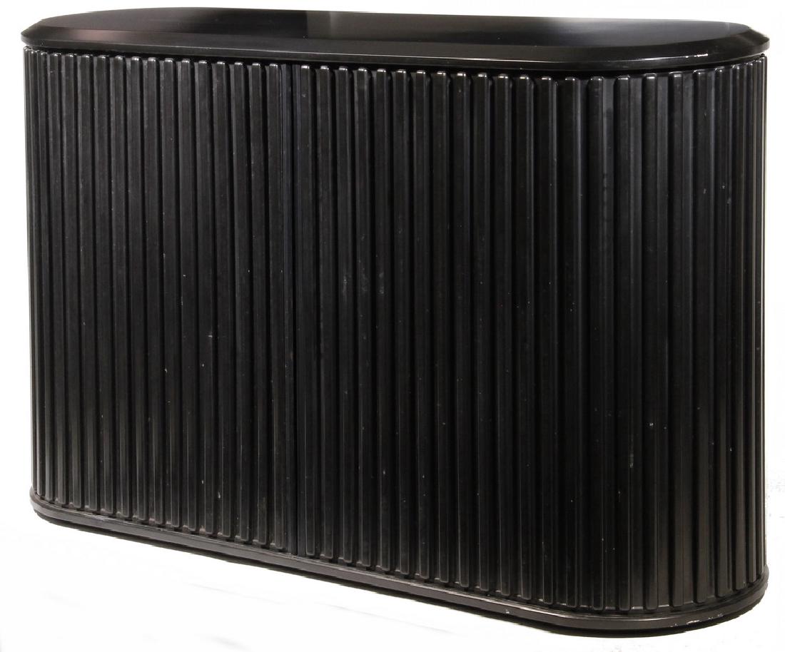 MODERN BLACK CREDENZA WITH TAMBOUR DOORS: Lozenge Shaped, split tambour, two shelf interior, satin black finish, unmarked, circa 1985, 29 1/2" x 48" x 14 1/2". One spot on top.